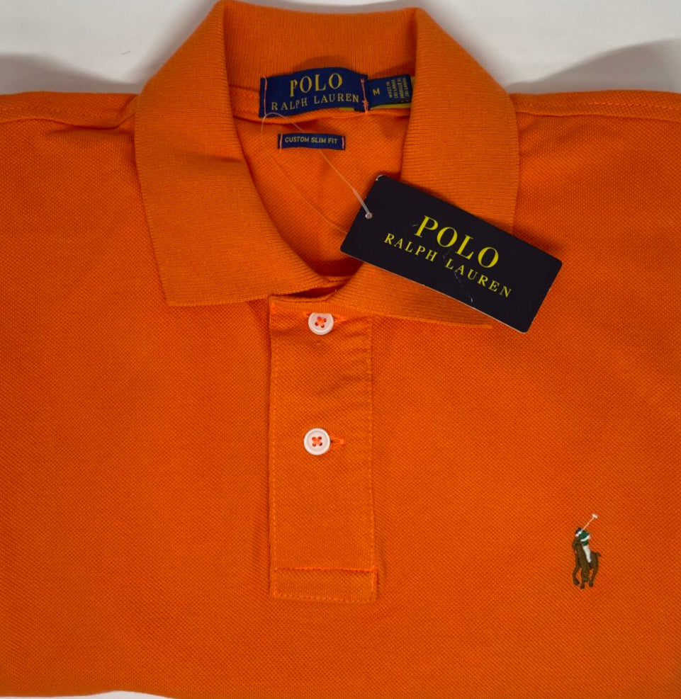 Orange Polo Ralph Lauren shirt with tag on a white background